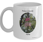 Coffee Mugs with Light Pink Roses. Mug has a soft pink rose image with a tree lined background. Coffee Mug for those who have a love for roses in nature.  Enjoy this nice nature setting behind these light pink roses. Light Pink Rose Mug Gift for the Roses Lover.