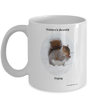 Nature Lover Coffee Mug with Squirrel in Snow Squirrel Eating a Nut in the Snow on one of our Nature Lover Coffee Mugs.